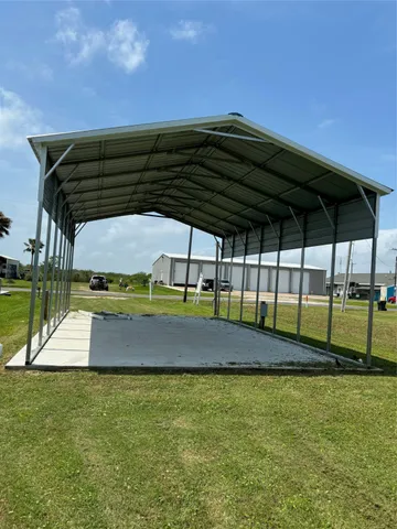 a view of building with outdoor space and trees