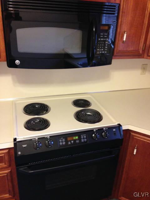 853 Cold Spring Road Allentown, PA 18103 - Photo 12 of 27 a close view of stove and microwave