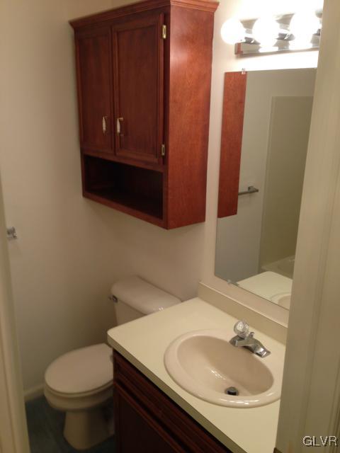 853 Cold Spring Road Allentown, PA 18103 - Photo 21 of 27 a bathroom with a sink a toilet and mirror