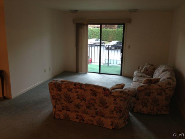 853 Cold Spring Road Allentown, PA 18103 - Photo 7 of 27 a bed sitting in a bedroom next to a window
