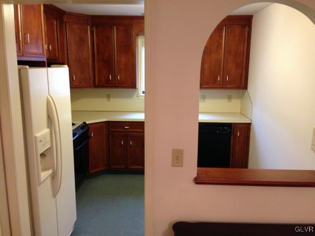 853 Cold Spring Road Allentown, PA 18103 - Photo 10 of 27 a view of a kitchen with fridge and wooden floor