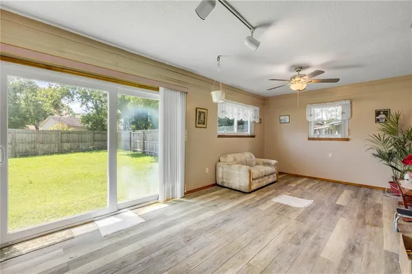 a view of a dining room with furniture and wooden floor