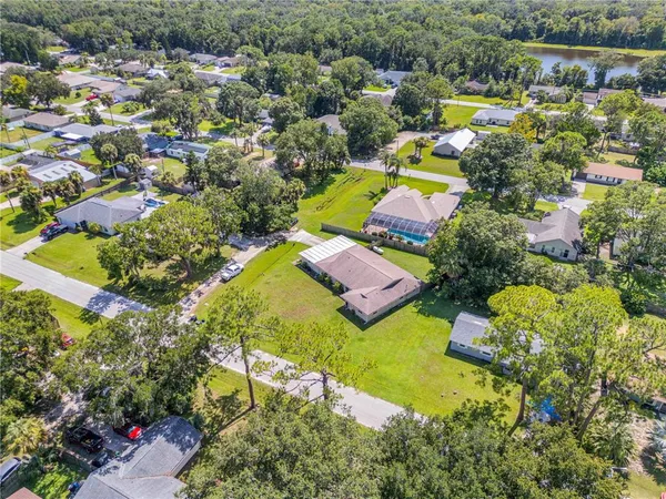 an aerial view of residential building with green space