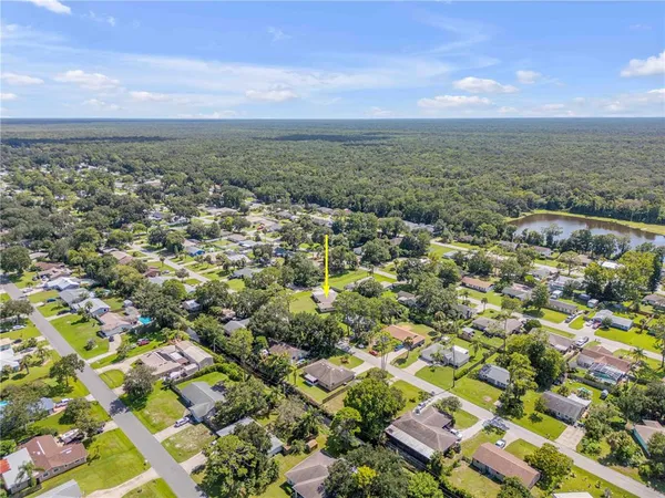 an aerial view of residential building and green space