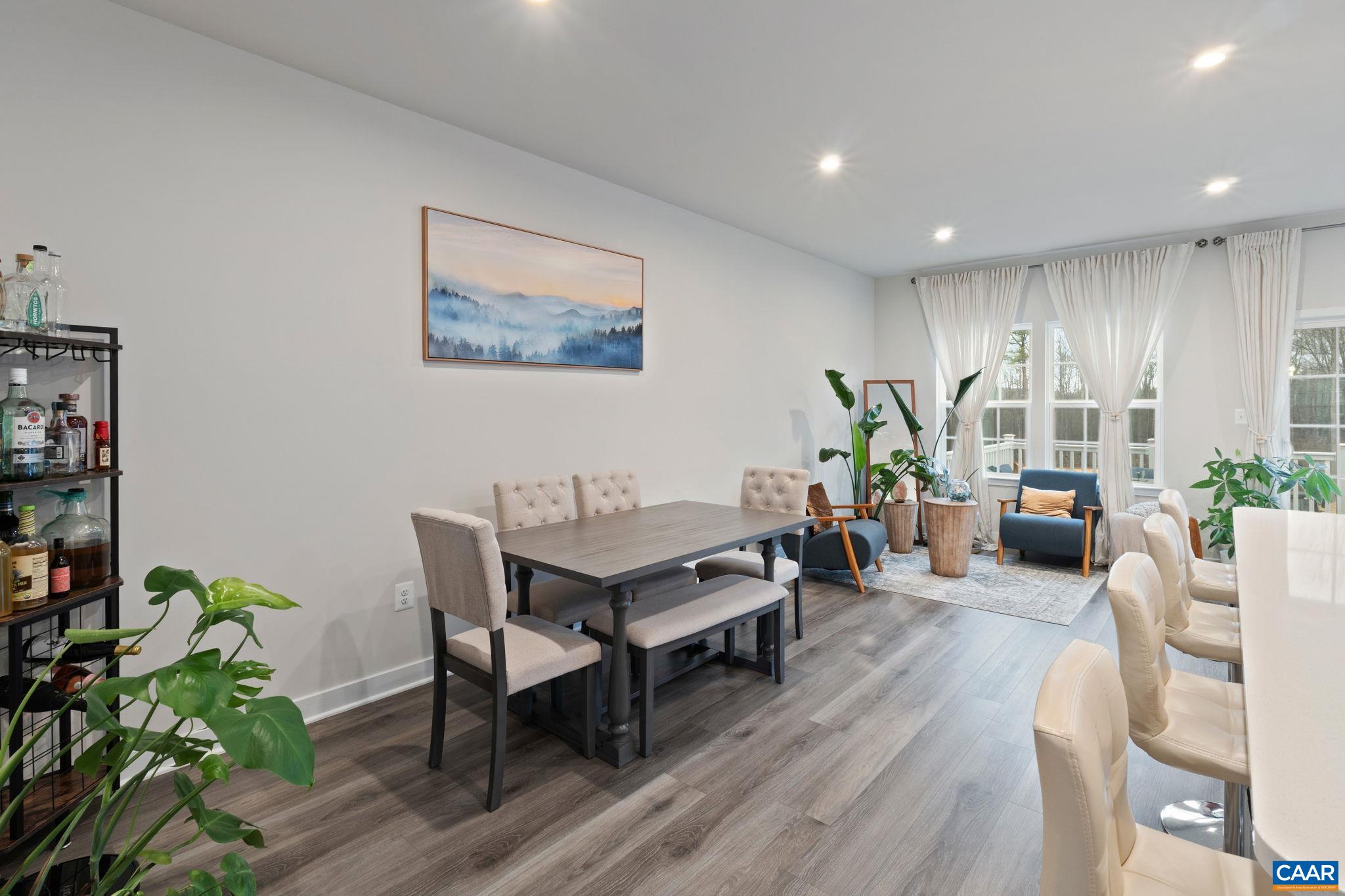 2402 Crescent Way Charlottesville, VA 22911 - Photo 13 of 27 Open dining area with modern flooring, recessed lighting, and seamless flow to the living space, perfect for everyday meals and entertaining.