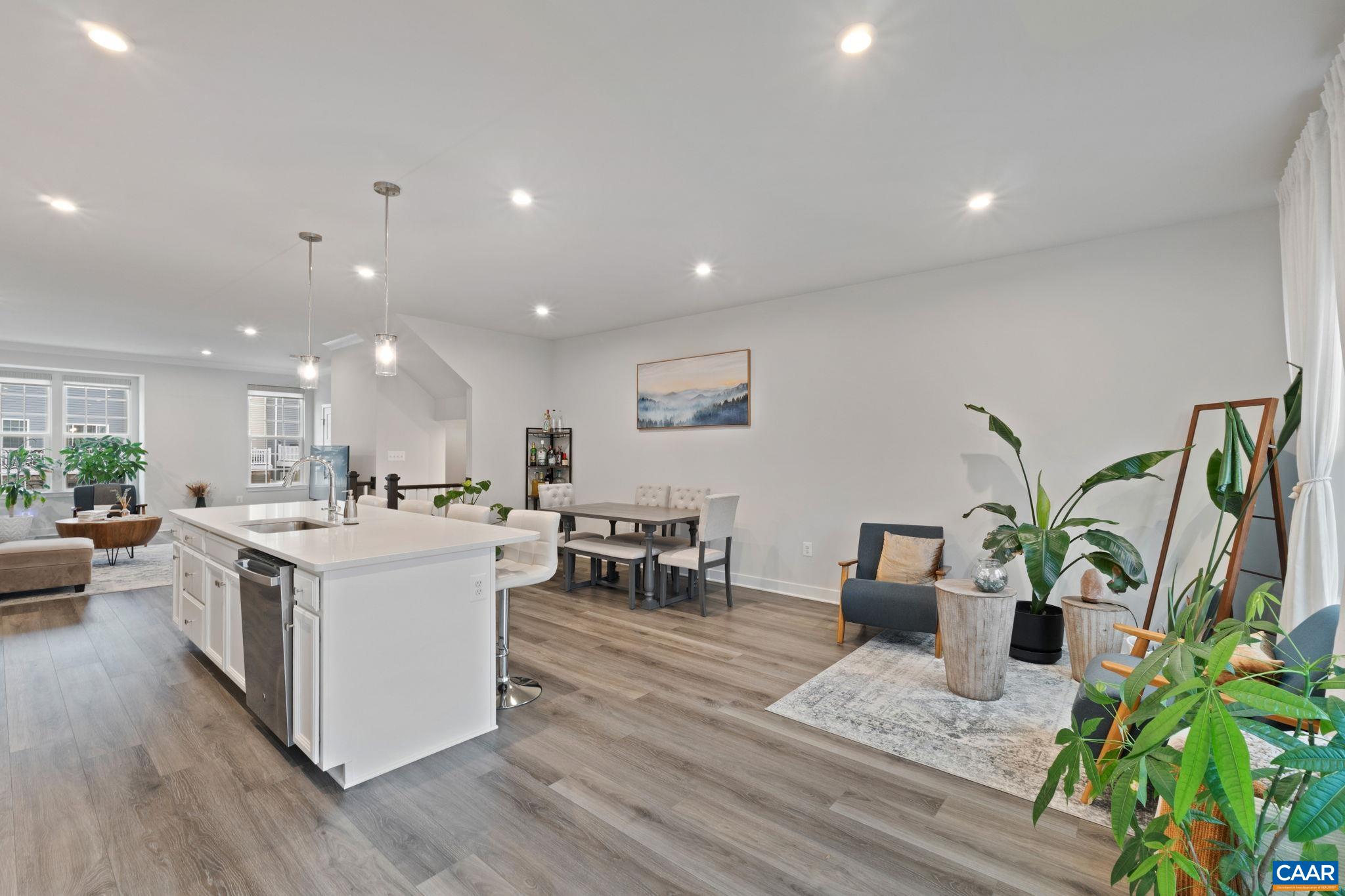 2402 Crescent Way Charlottesville, VA 22911 - Photo 15 of 27 Expansive open-concept main level featuring seamless flow between kitchen, dining, and living areas—perfect for entertaining and everyday living.