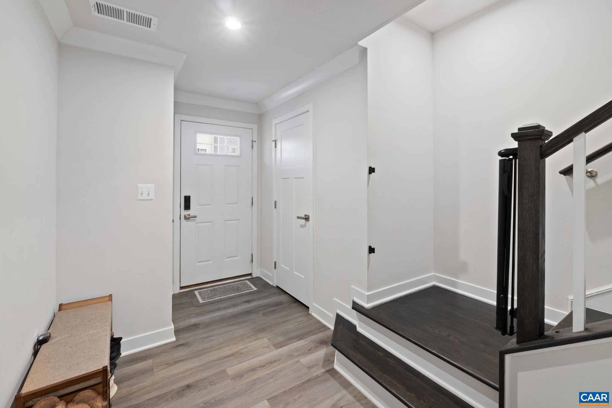 2402 Crescent Way Charlottesville, VA 22911 - Photo 5 of 27 Bright entry foyer with direct access from front door, featuring durable flooring and convenient layout connecting to stairs and main living areas.