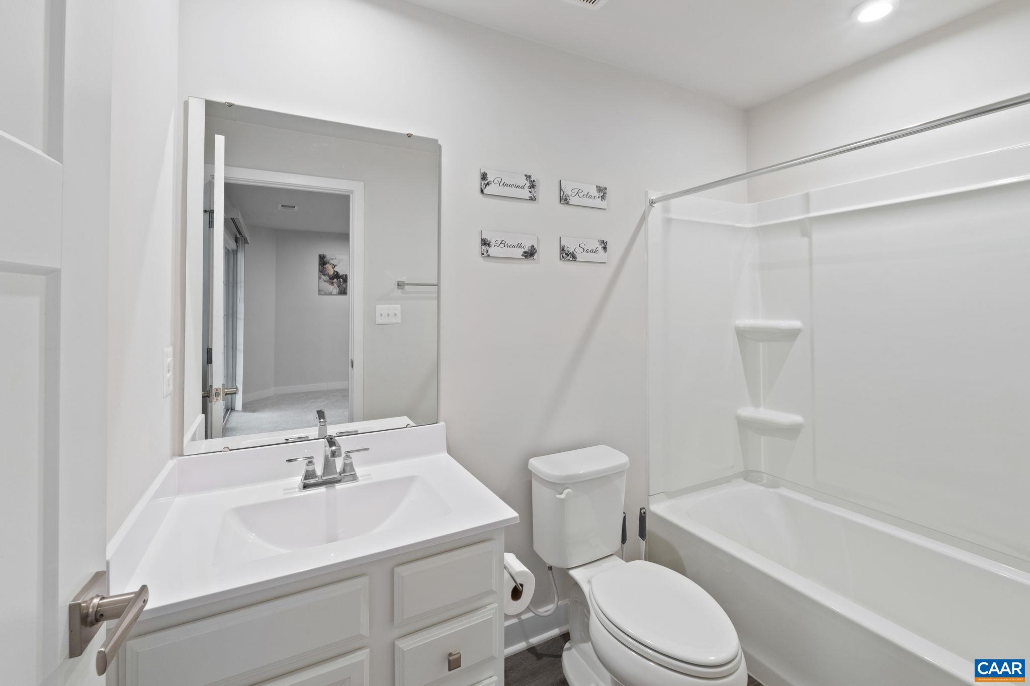 2402 Crescent Way Charlottesville, VA 22911 - Photo 9 of 27 Full bathroom featuring single vanity, tub/shower combination, and clean, modern finishes.