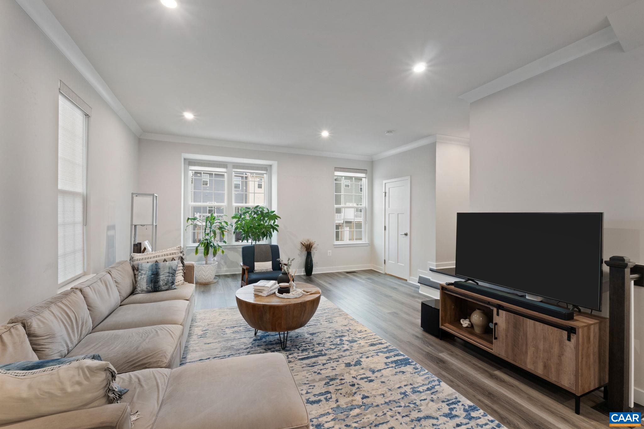 2402 Crescent Way Charlottesville, VA 22911 - Photo 10 of 27 Alternate view of living area showcasing large windows, natural light, and comfortable layout.