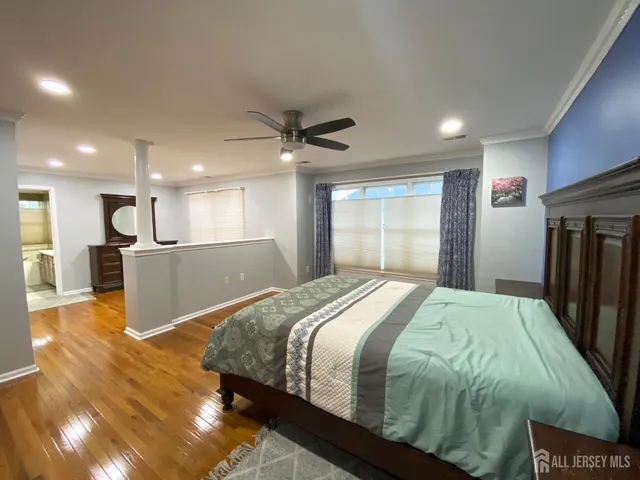 a bed room with a bed and a television