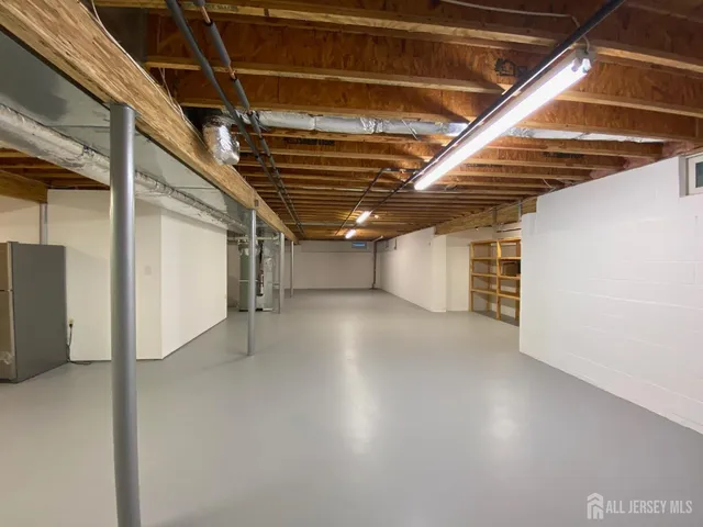 a view of water heater room with a garage