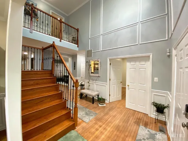 a view of an entryway with wooden floor and windows