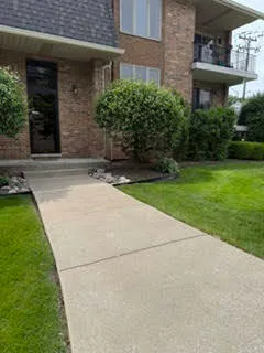 a view of a brick house with a yard