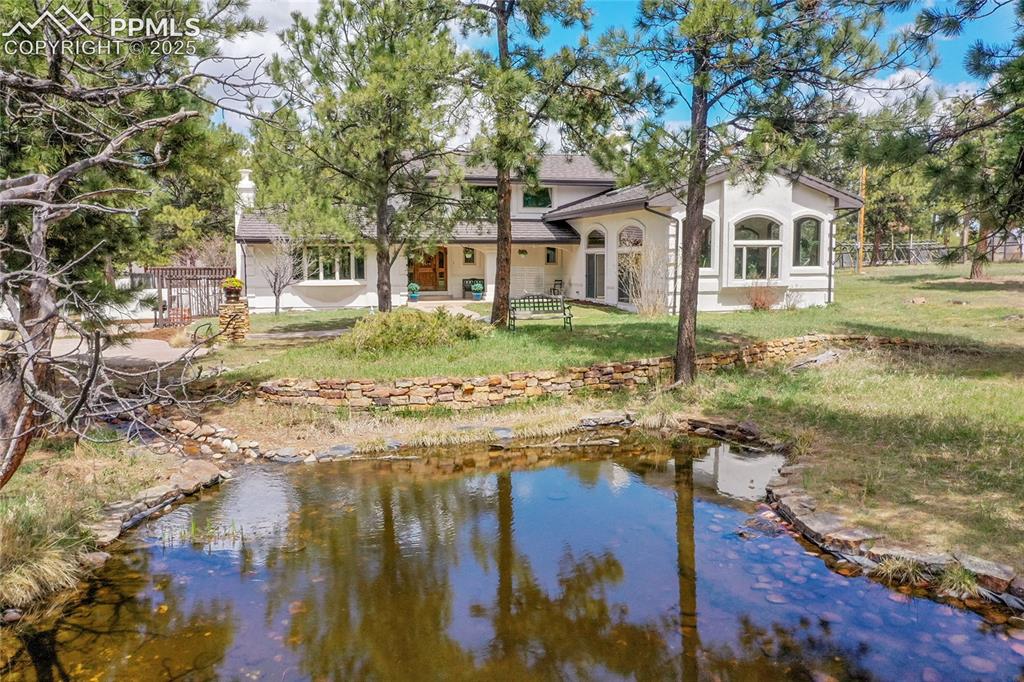 17350 Goshawk Road Colorado Springs, CO 80908 - Photo 39 of 50 a front view of a house with a yard