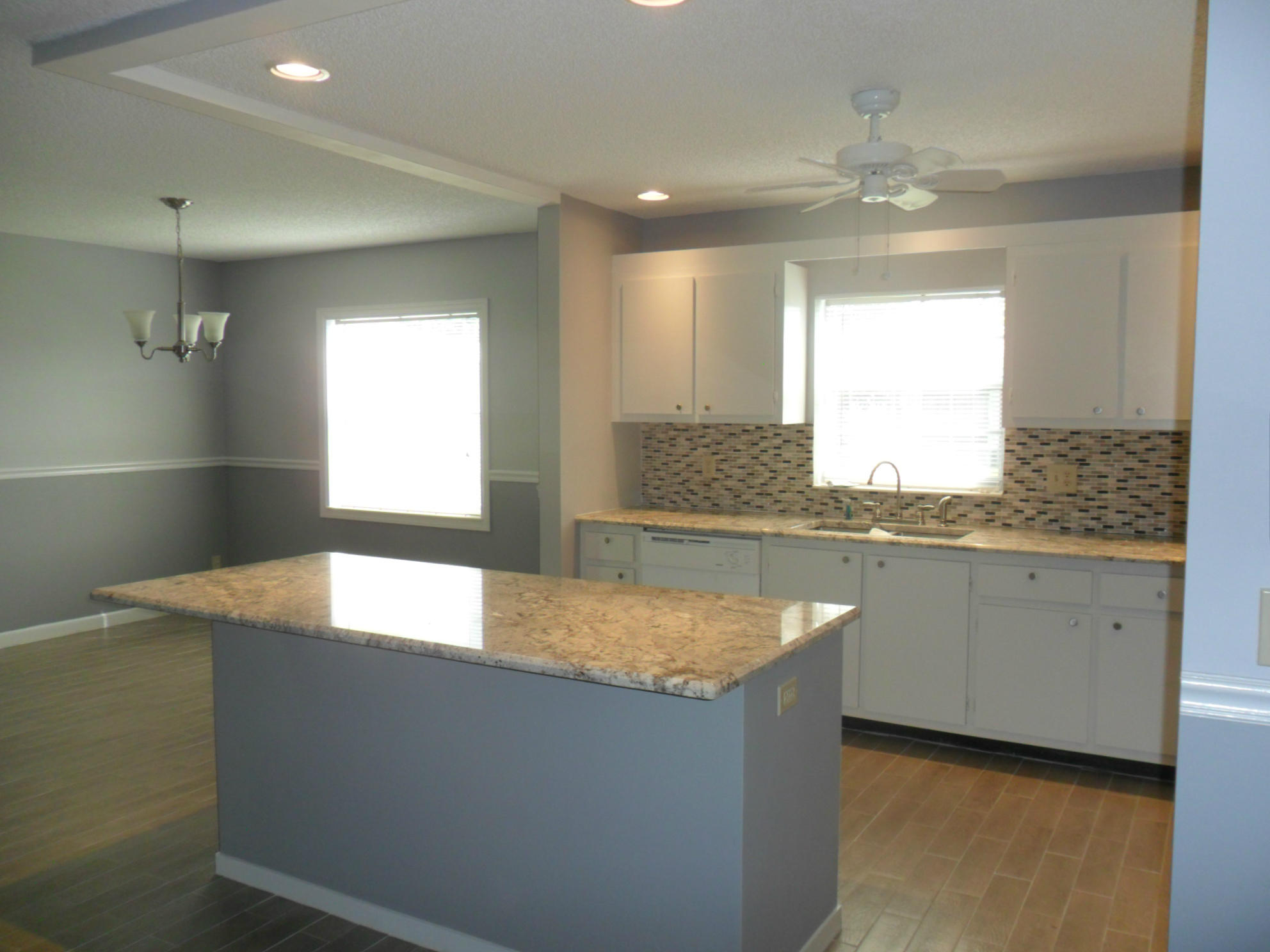 6311 Lasalle Road Delray Beach, FL 33484 - Photo 4 of 34 a kitchen with a sink granite counter tops and a window