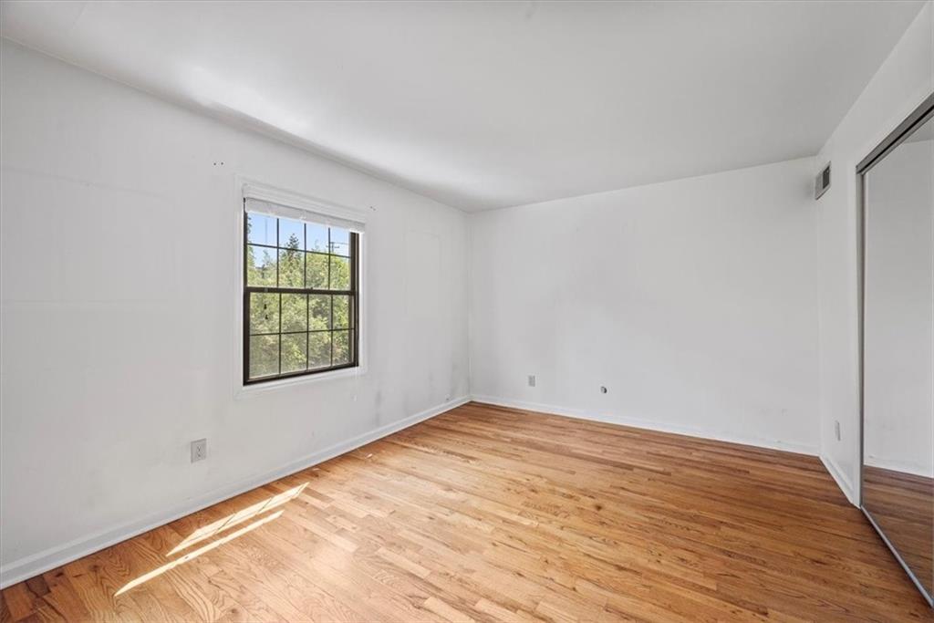 428 Country View Court Pittsburgh, PA 15205 - Photo 15 of 28 an empty room with wooden floor and windows