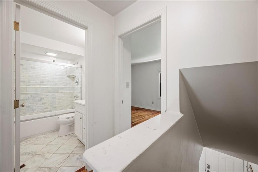 428 Country View Court Pittsburgh, PA 15205 - Photo 20 of 28 a bathroom with a granite countertop toilet a sink and a large mirror
