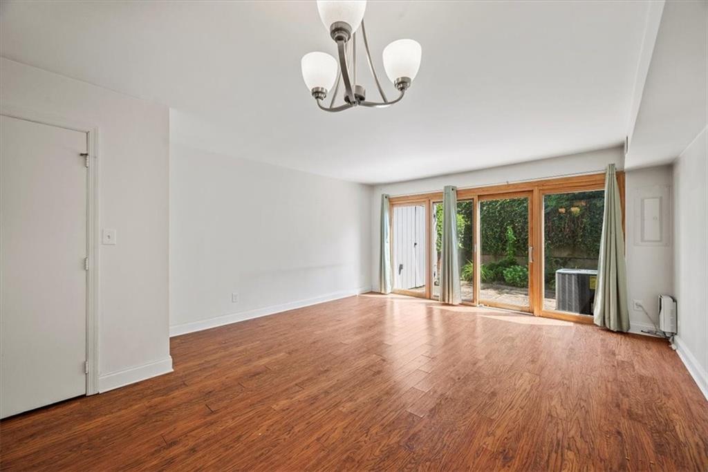 428 Country View Court Pittsburgh, PA 15205 - Photo 6 of 28 a view of an empty room with wooden floor and a window