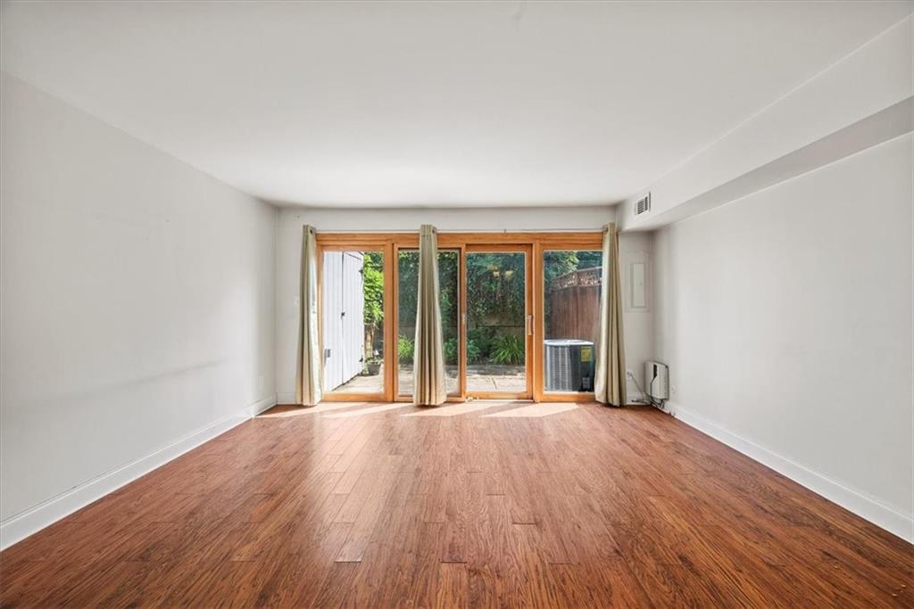 428 Country View Court Pittsburgh, PA 15205 - Photo 7 of 28 wooden floor in an empty room with a window