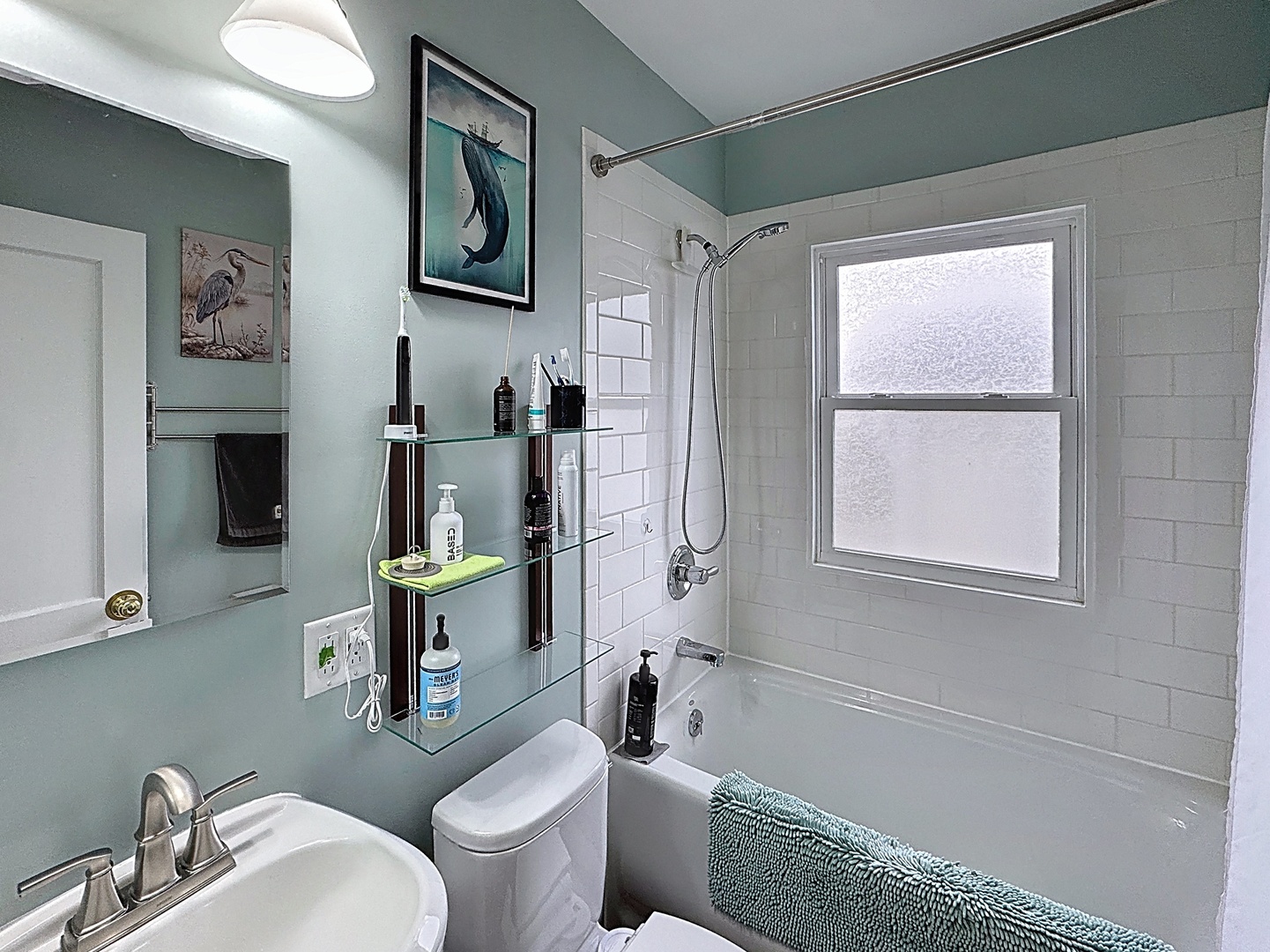 509 40th Street East Moline, IL 61244 - Photo 11 of 23 a bathroom with a toilet sink and mirror