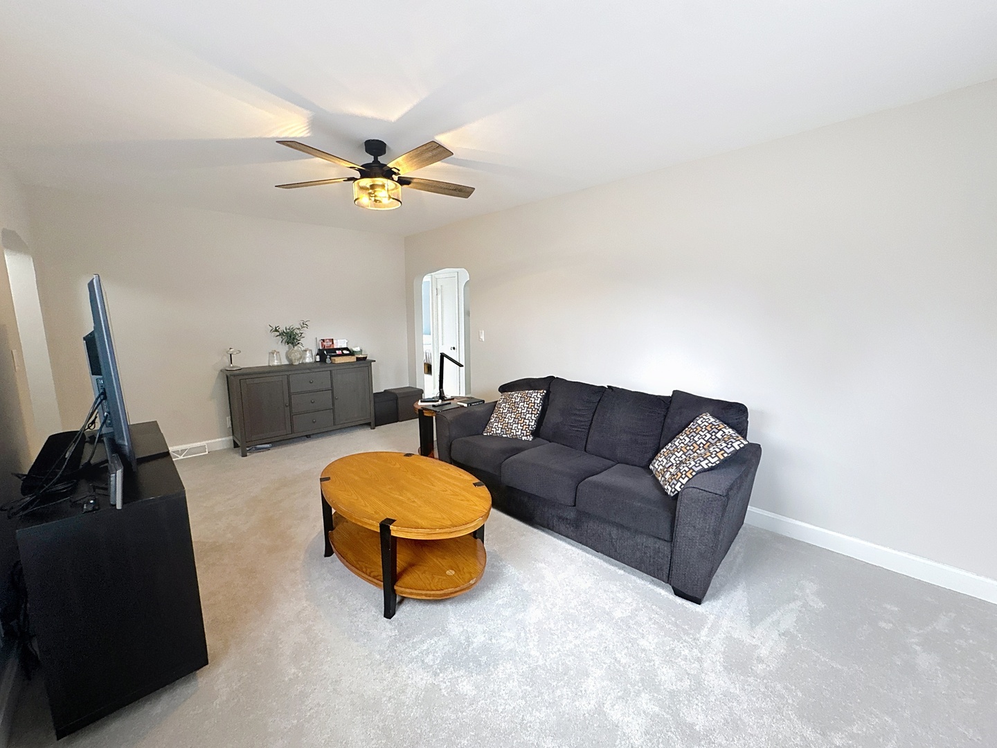 509 40th Street East Moline, IL 61244 - Photo 3 of 23 a living room with furniture a ceiling fan and a rug