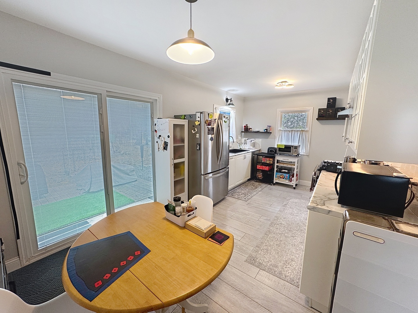 509 40th Street East Moline, IL 61244 - Photo 5 of 23 a view of a kitchen with fridge and workspace