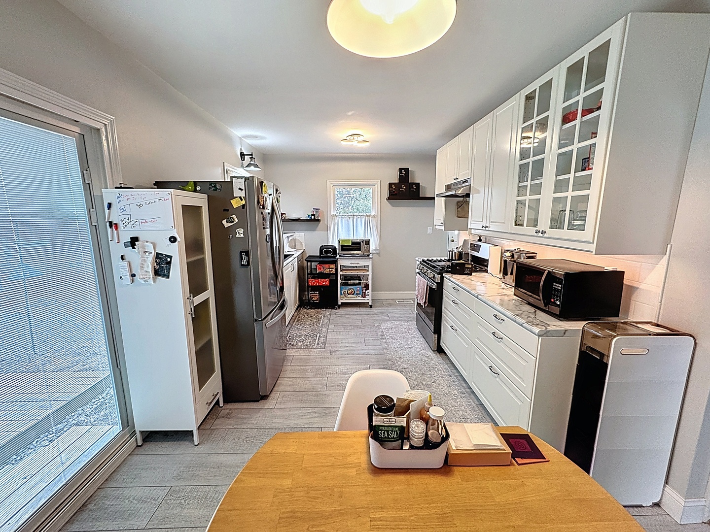 509 40th Street East Moline, IL 61244 - Photo 6 of 23 a view of a kitchen with fridge and workspace