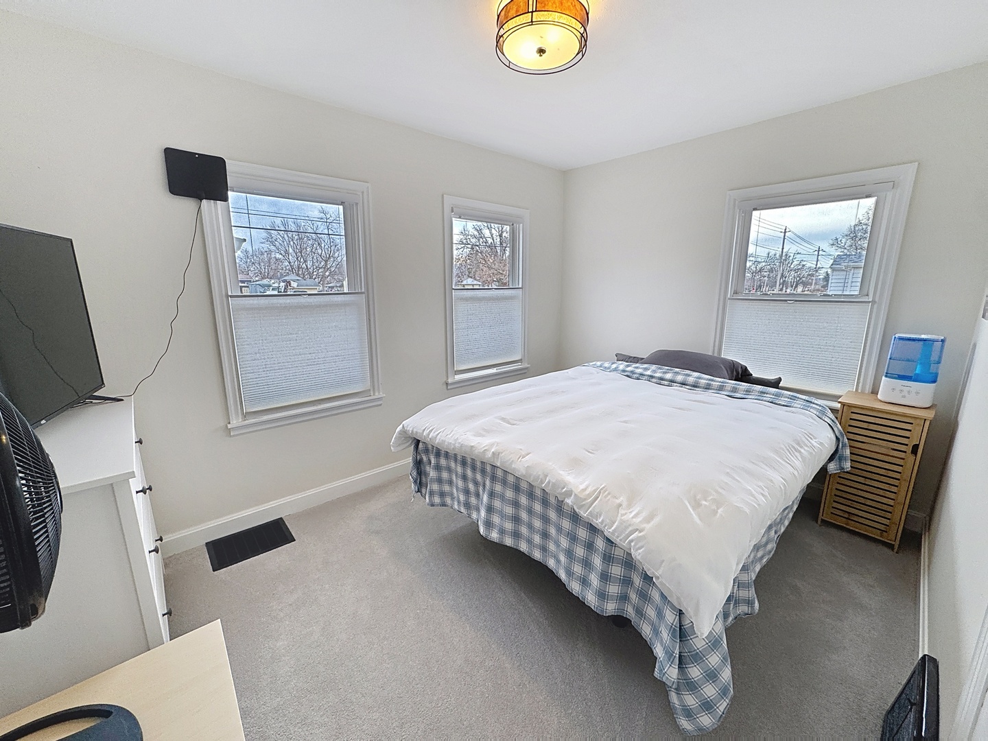 509 40th Street East Moline, IL 61244 - Photo 9 of 23 a bedroom with a bed and a desk