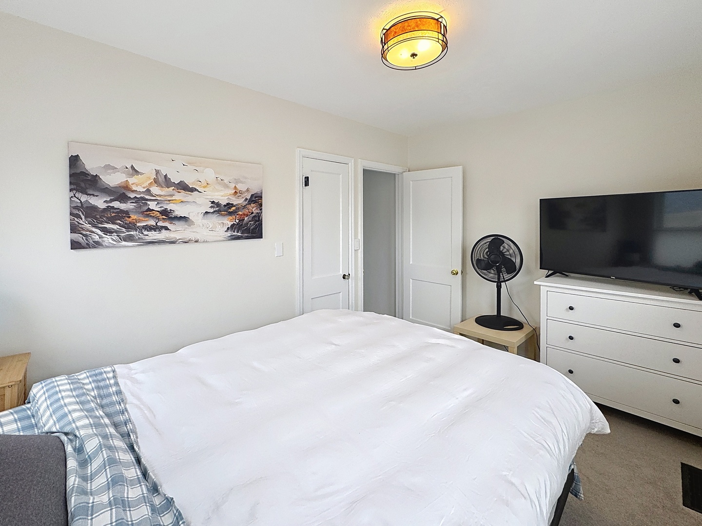 509 40th Street East Moline, IL 61244 - Photo 10 of 23 a bedroom with a bed and a flat screen tv