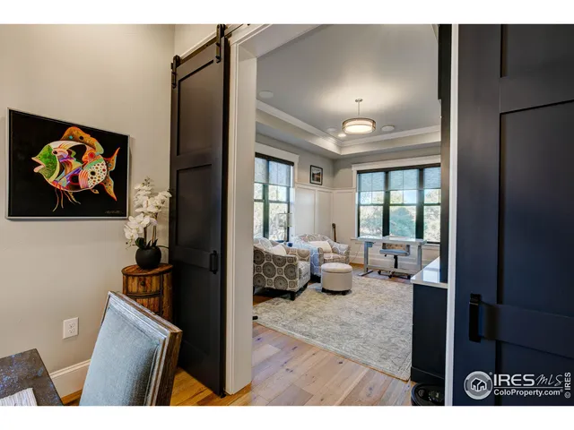 a view of living room filled with furniture and a painting