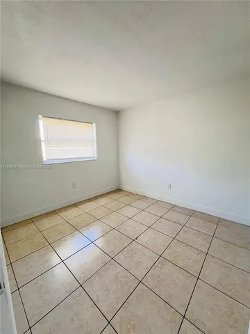 a view of a room and window