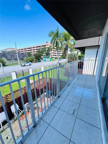 a view of a balcony with furniture