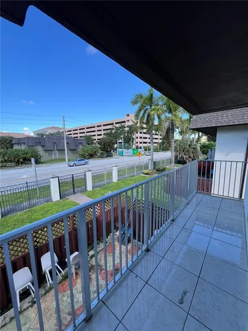 a view of a deck with a big yard