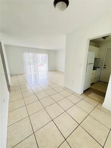 a view of a livingroom and entryway