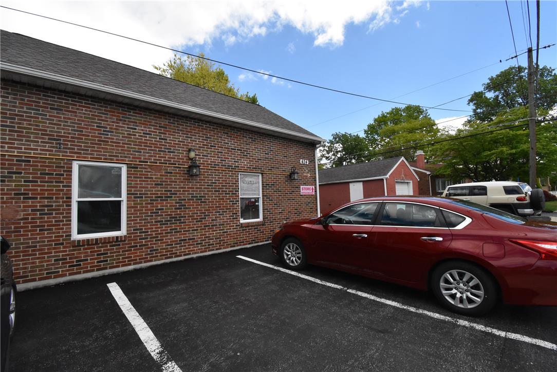 424 Grape Street Whitehall, PA 18052 - Photo 5 of 50 This commercial building features a brick exterior and a paved parking lot.