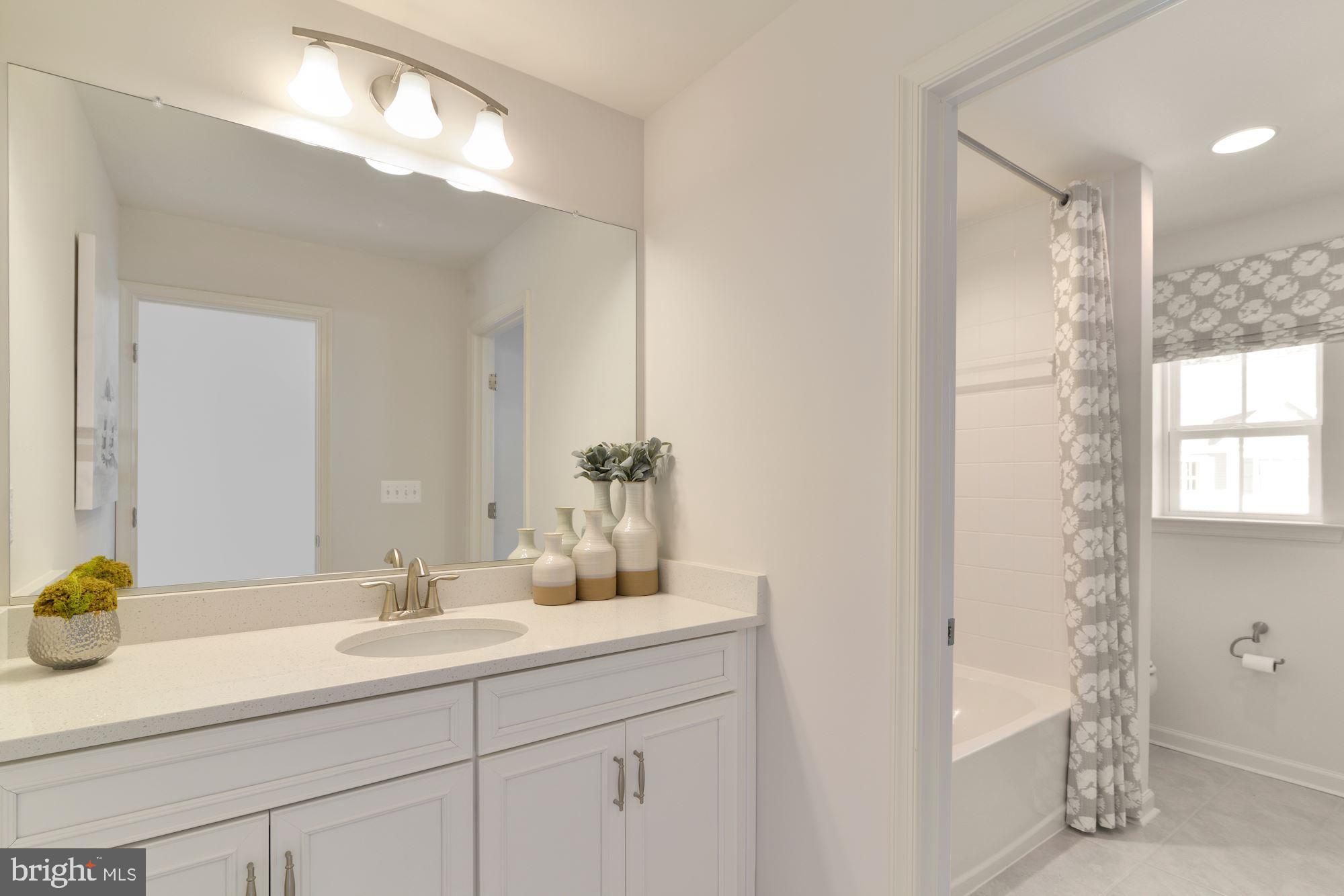 4249 Market Place Perry Hall, MD 21128 - Photo 12 of 17 a bathroom with a sink and a mirror