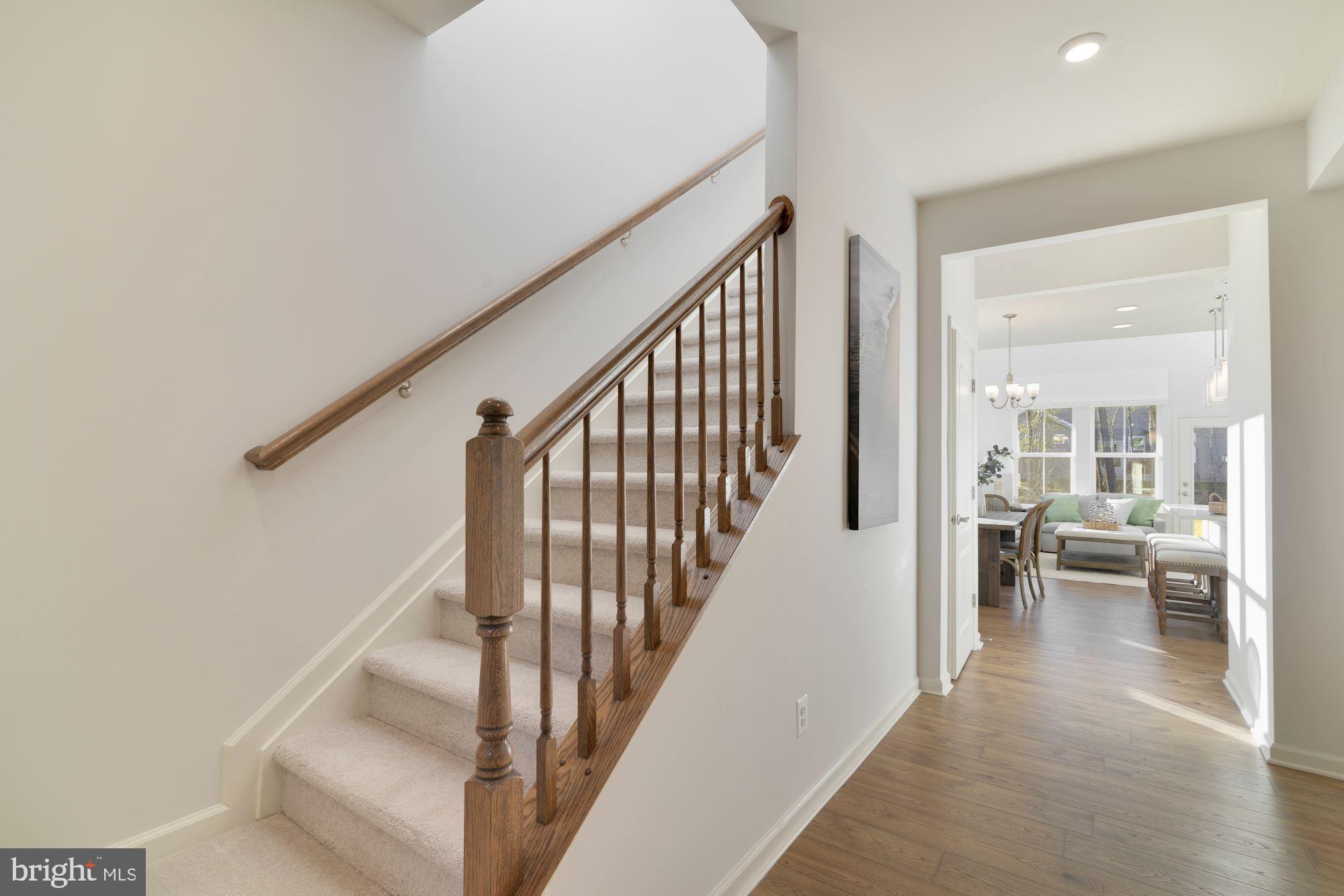 4249 Market Place Perry Hall, MD 21128 - Photo 2 of 17 a view of a hallway with wooden floor and furniture