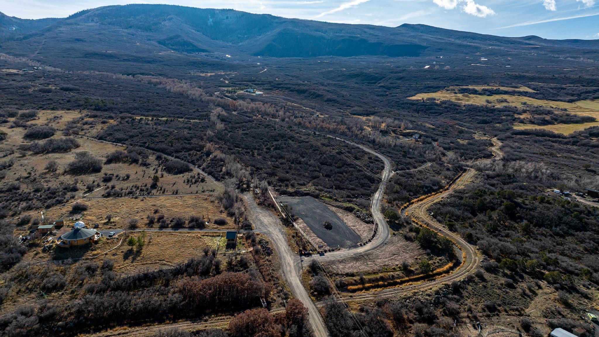 53999 Bull Basin Road Molina, CO 81646 - Photo 26 of 41 a view of a backyard with wooden fence
