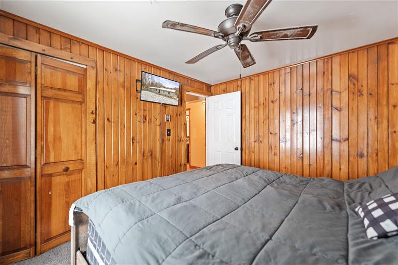 5158 McCandless Road Butler, PA 16001 - Photo 21 of 41 a bed room with a bed and a chandelier