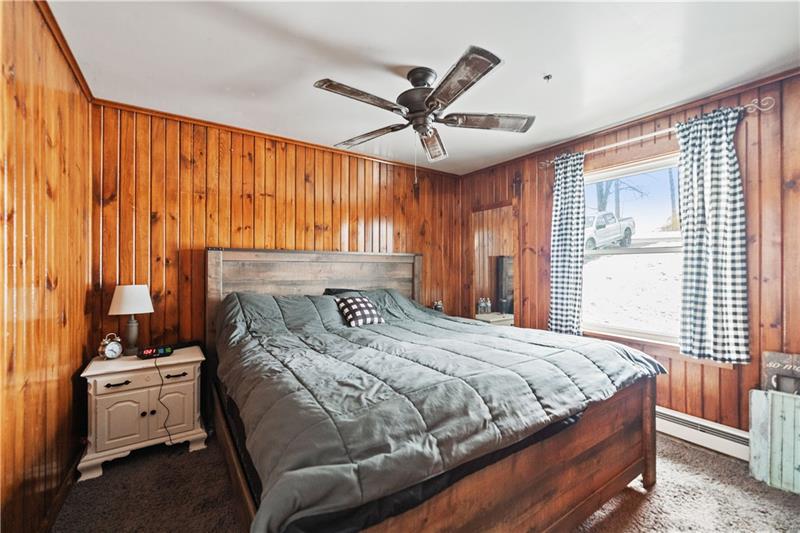 5158 McCandless Road Butler, PA 16001 - Photo 23 of 41 a bedroom with a bed and a chandelier