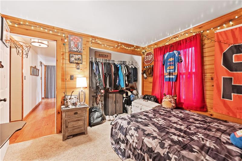 5158 McCandless Road Butler, PA 16001 - Photo 25 of 41 a bed room with a bed and a large mirror
