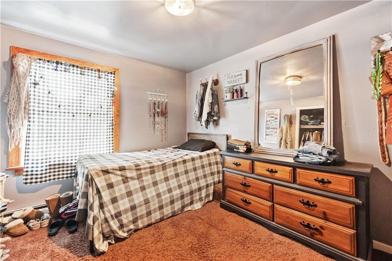 5158 McCandless Road Butler, PA 16001 - Photo 28 of 41 a bedroom with a bed and a dresser