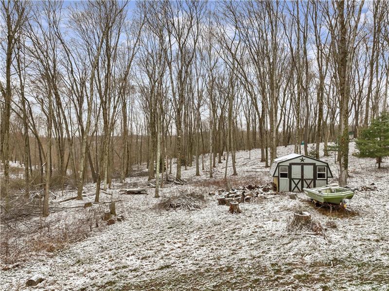 5158 McCandless Road Butler, PA 16001 - Photo 40 of 41 a backyard of a house with trees and outdoor space