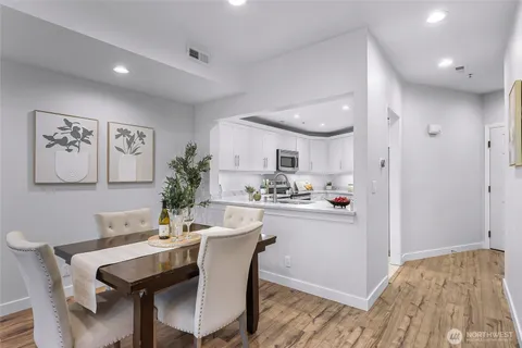 a kitchen with a table and chairs in it