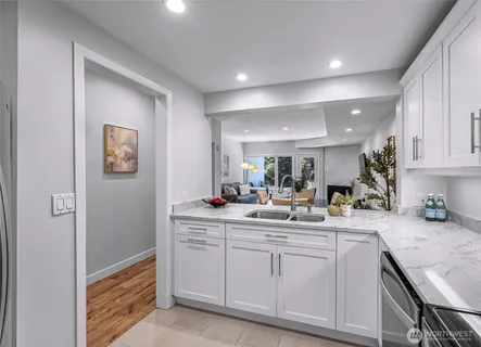 a kitchen with sink and cabinets