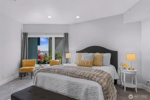 a bedroom with a bed and a couch