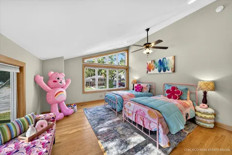 a view of a workspace with furniture and wooden floor
