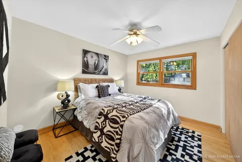 a bathroom with a sink a toilet and a window