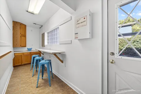 an aerial view of residential houses with outdoor space and swimming pool