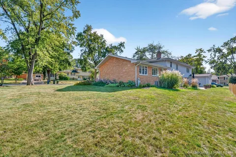 an aerial view of a house with a lake view